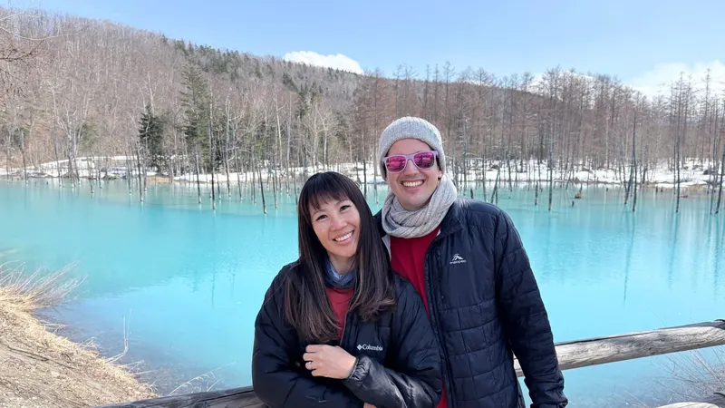 Pim and Milan by a turquoise lake in Hokkaido